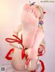 A woman in a red and white outfit is tied up with a rope.